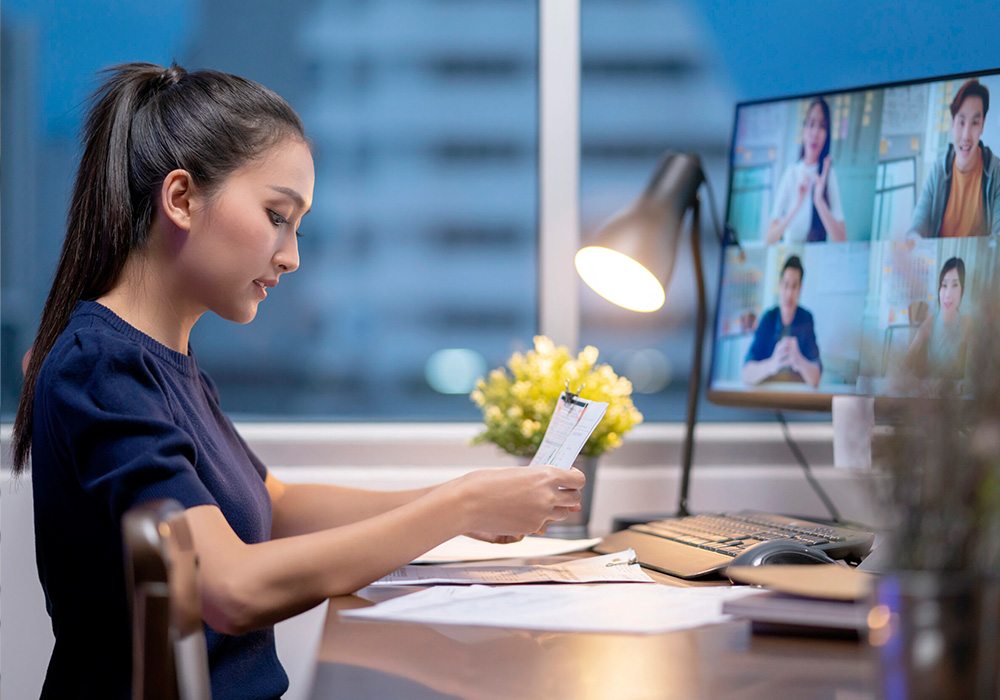 remote team member in video meeting