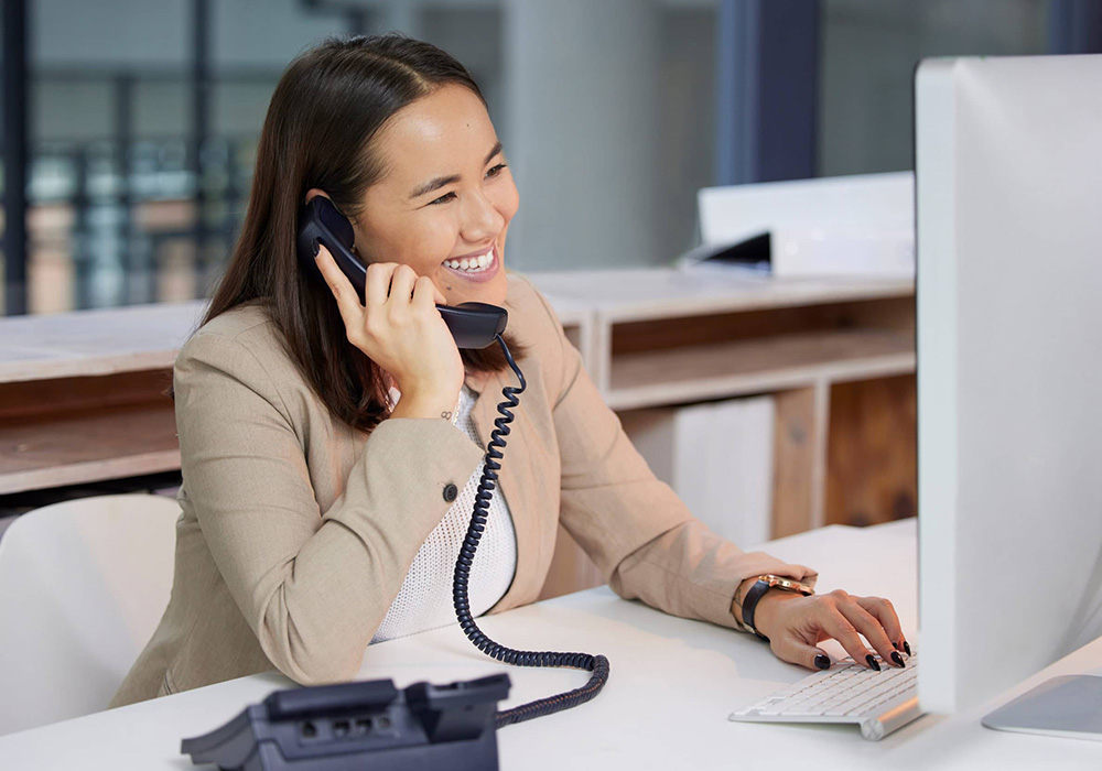smiling assistant handling client calls