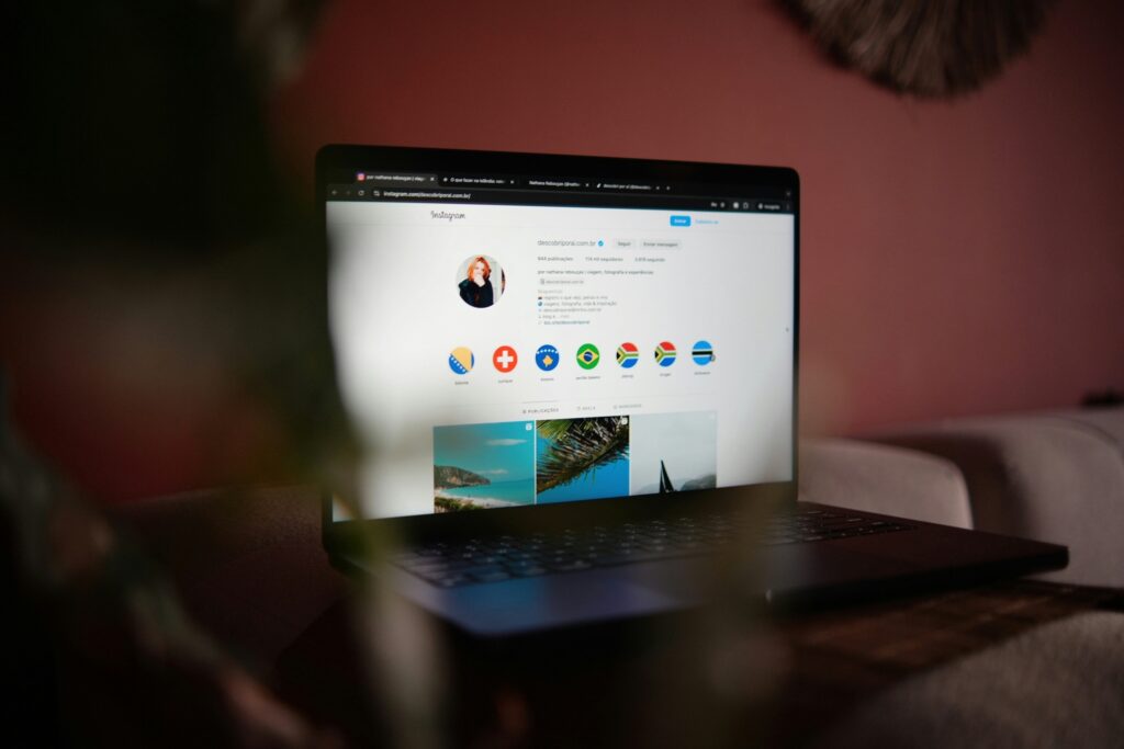 A person looking through her laptop checking her Instagram profile - Virtual Pro Solutions